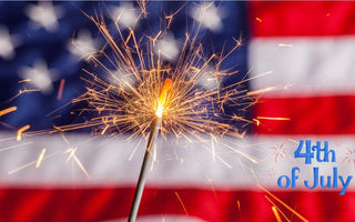 Fourth of July herbal tea celebration with fireworks and American flag in the background — organic wellness tea for digestion and energy
